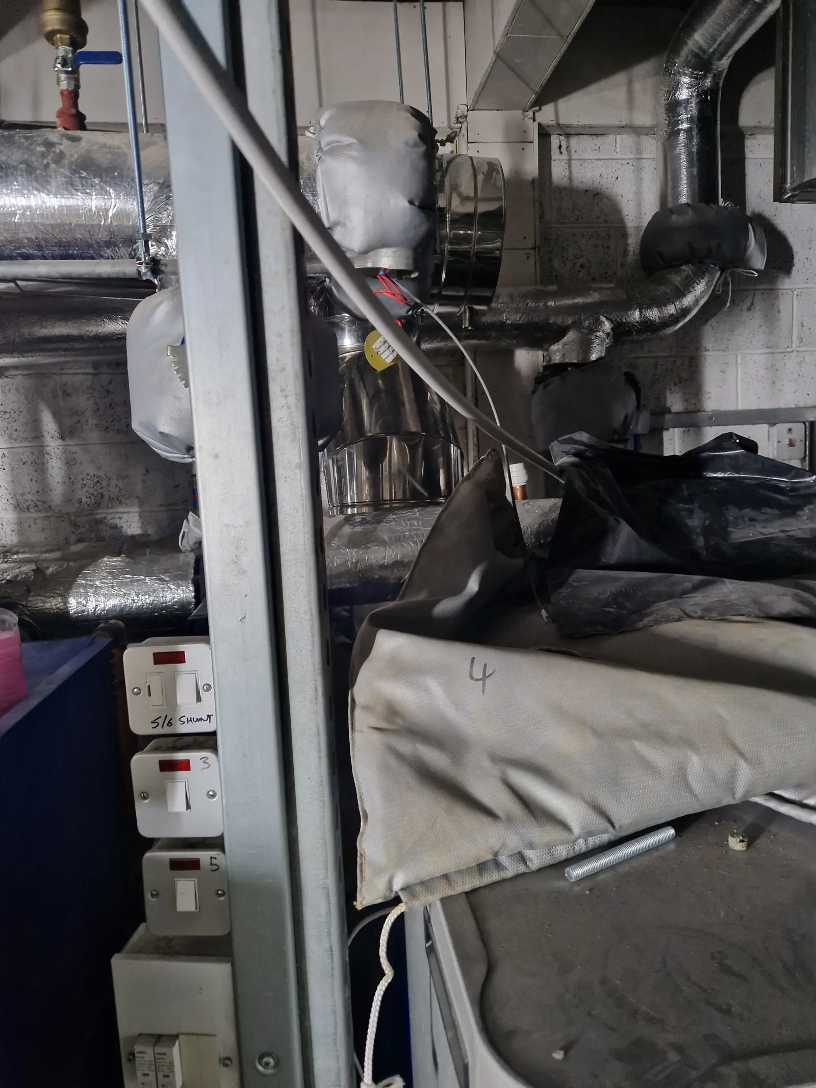 Existing school plant room flues before seal replacement